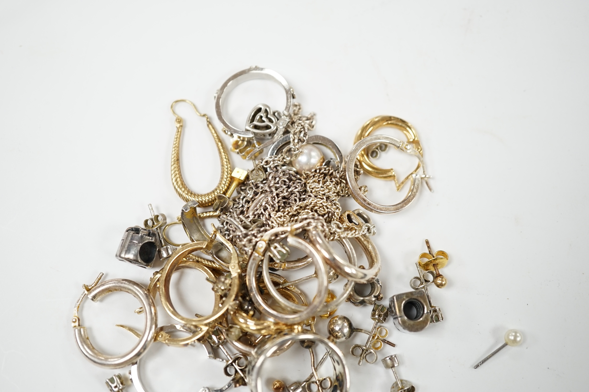 Four assorted pairs of modern 9k earrings, a 9ct white gold band, gross 10.8 grams and a small quantity of 925 jewellery. Condition - poor to fair